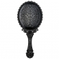 Kosmetischer Weinlesespiegel Blumendruckhand hält Spiegelmake-Upschönheitswerkzeug schwarz